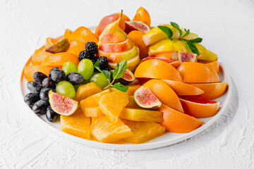 Exotic fruits platter isolated on white