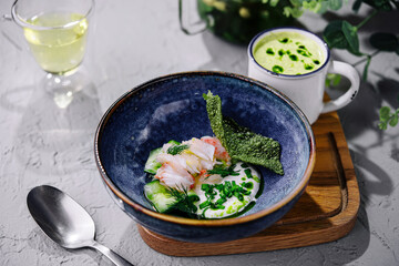 creamy spinach soup with prawns top view