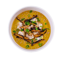 Pumpkin soup with mushrooms, sour cream and herbs and mozzarella