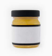 Ghee butter in a glass jar isolated on white