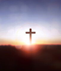 Silhouette jesus christ cross on sunrise background