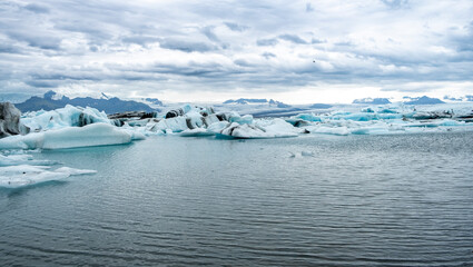 Iceberg drifting in Jokulsarlon glacier bay in  Southeast Iceland, Europe. Popular travel...