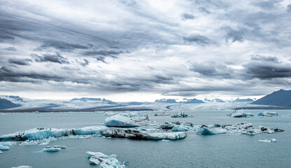 Fototapeta na wymiar Iceberg drifting in Jokulsarlon glacier bay in Southeast Iceland, Europe. Popular travel destination of Iceland
