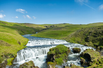 kogar river in iceland which creates skogafoss waterfalls - South Iceland, Europe - popular destination for tourists