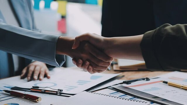 Meeting and greeting concept, Two confident Business handshake and business people after discussing good deal of Trading contract and new projects for both companies, success, partnership, co worker.