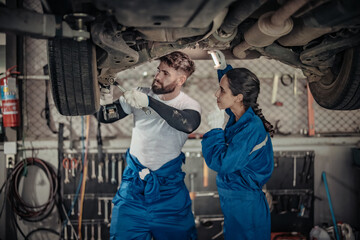Auto mechanics diagnose suspension issues using precise tools, ensuring safe vehicle performance.