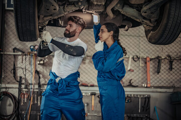 Auto mechanics diagnose suspension issues using precise tools, ensuring safe vehicle performance.