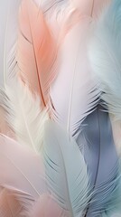 An array of tiny and delicate feathers in soft pastel hues. Vertically oriented. 