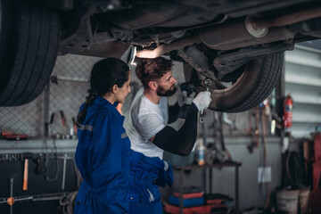 Auto mechanics diagnose suspension issues using precise tools, ensuring safe vehicle performance.