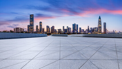 City square and skyline with modern buildings in Shenzhen at sunset, Guangdong Province, China....