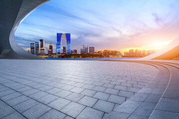 City square and skyline with modern buildings at sunset in Suzhou, Jiangsu Province, China. - obrazy, fototapety, plakaty