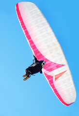 Person, parachute or paragliding in air in nature, exercise or healthy adventure for extreme sport....