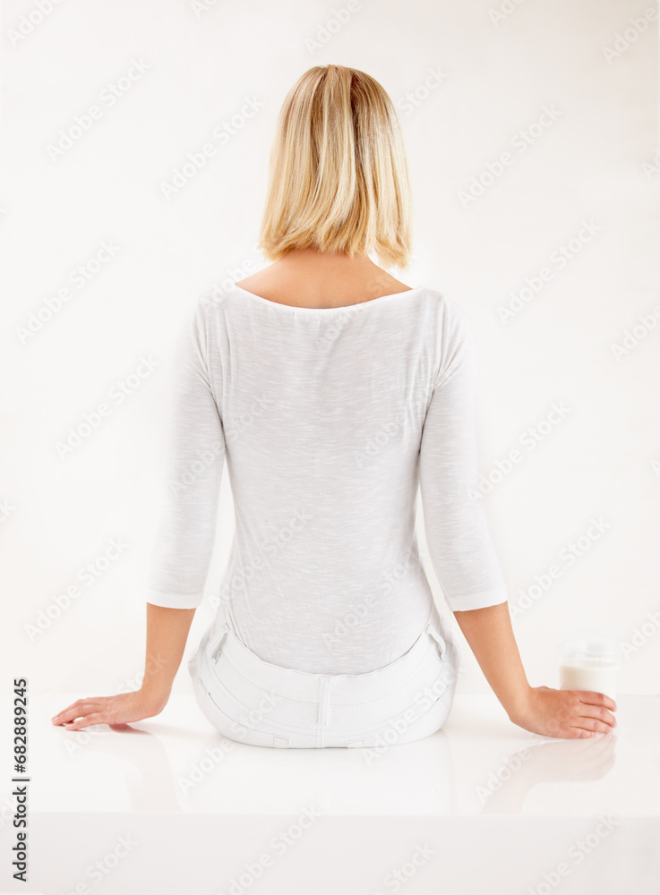 Canvas Prints Woman, drink and milk in studio nutrition for dairy calcium, vitamin benefits or cold glass. Female person, white background and mockup as breakfast beverage or smoothie thinking, diet or weight loss