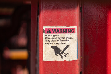 The caution sign to inform pinch point and hand injury hazard which is displayed on the machinery...