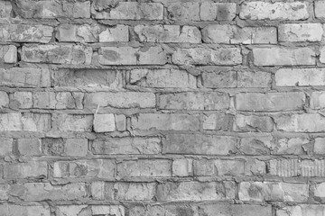 Old brickwork wall gray cement interlayer texture rough background brick weathered grey