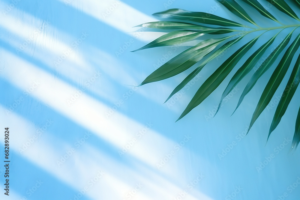 Poster blurred shadow from palm leaves on the light blue wall. minimal abstract background for product pres