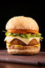 Vegetarian soy burger breaded with lettuce, tomato and mustard bread