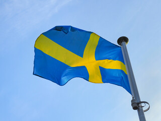 The national flag of Sweden. Consists of a yellow or gold Nordic (Christianity) cross on a field of...