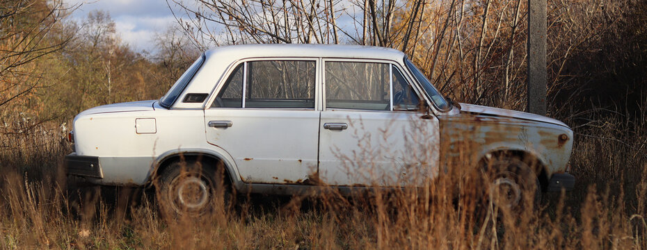 Very rusty old Soviet car - VAZ 2101 side view.