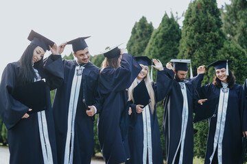 Group of University Students Celebrating Graduation in Sunny Park