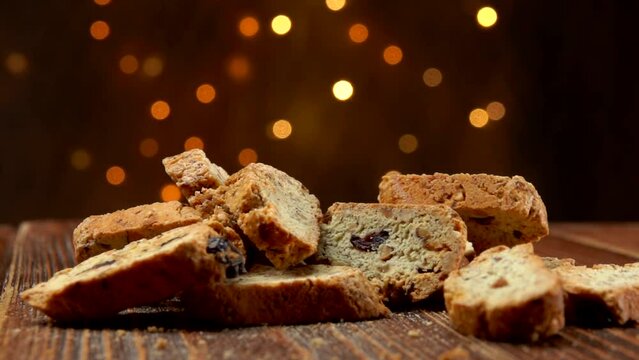 italian cantucci with almond and cranberries falls on a wooden surface
