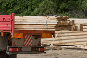 Car automobile with trailer wooden planks industrial material. Wood Industry and Transportation