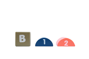 The word B12 is made with colorful building blocks isolated on a white background.