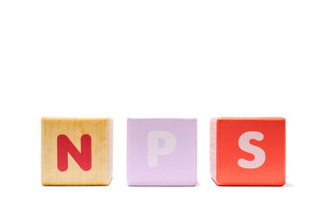 text NPS NET PROMOTER SCORE on colorful wooden isolated on a white background