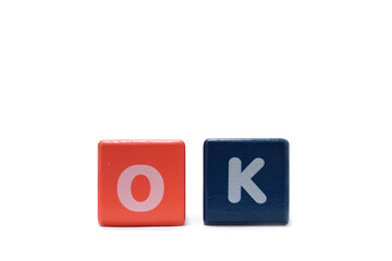 text OK on colorful wooden isolated on a white background