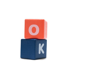 text OK on colorful wooden isolated on a white background.