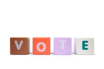text VOTE on colorful wooden isolated on a white background