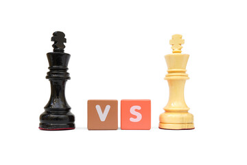 Close up shot of king vs king in chess and text VS wooden isolated on a white