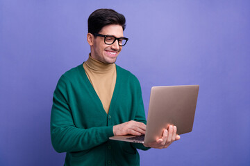 Photo of handsome man entrepreneur wear stylish clothes typing texting letter isolated on purple color background