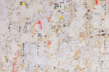 Old dirty tattered torn paper bulletin board texture background