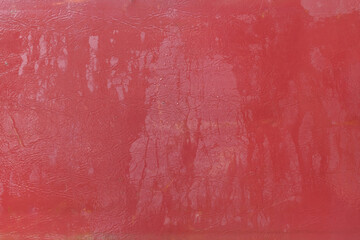 Wet water surface of red leather streaks background texture