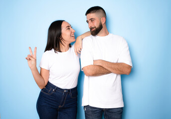 Fototapeta premium Happy loving couple isolated isolated on blue background