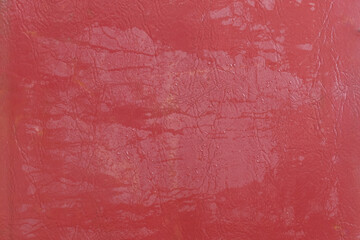 Wet water surface of red leather streaks background texture stain
