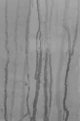 Gray streaks paint spilled surface ceramic tiles wall dirty texture background old grey