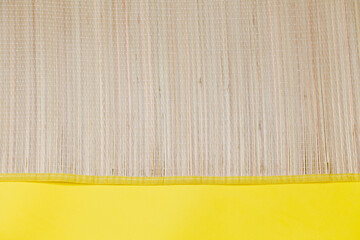 Mat detail on yellow background. Treadmill concept. Summer concept. Copy space.