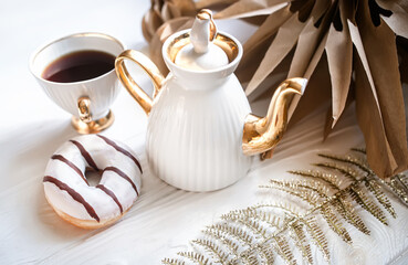 Christmas Star Made of Kraft Paper.Christmas dkkor on the table during coffee break. Cup and teapot with coffee