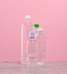 Thirst quenching. Plastic bottles with clear water.