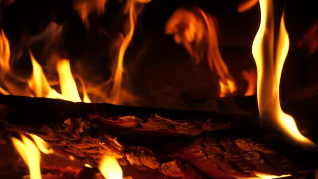 Fire is burning in the Fireplace Close up. Hearth. Warmth and home comfort. Flames in the country house.