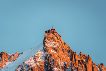 Observatory and antenna summit of Aiguille du Midi from Mont Blanc massif in French Alps at...