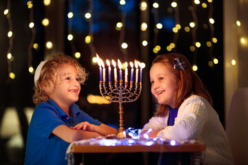 Kids celebrating Hanukkah. Festival of lights. - obrazy, fototapety, plakaty