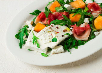 salad, melon with prosciutto, arugula, and cheese, summer salad, vegetarian, homemade, no people,
