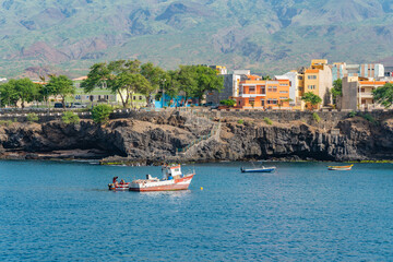 Coastal view with fisher boat on Santo Antao with the Atlantic Ocean at Porto Novo