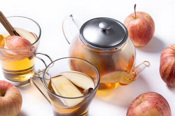 Autumn hot apple drink with spices isolated on white background