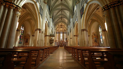 Fototapeta premium Fribourg, Switzerland Circa March 2022 - Sacred Glow, Interior of Saint Nicholas Cathedral, Catholic Reverence