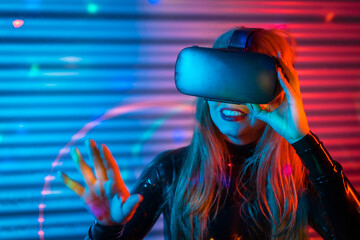 Woman touching a screen using virtual reality goggles