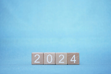 2024 wooden blocks on blue background